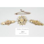 Three 9ct gold brooches and a 9ct gold brooch pendant set with seed pearls. Approx weight 11.7