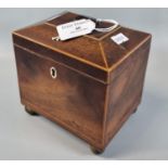 Small 18th century Georgian mahogany tea caddy with satinwood banding on brass ball feet, loop