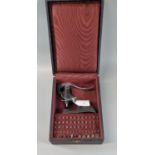 Swiss Seitz cast metal jewellers jewel press in fitted case with selection of assorted heads and