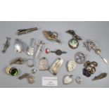 Collection of silver and costume jewellery including a silver slide rule brooch, St Christopher