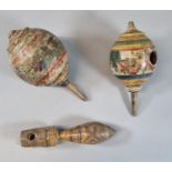 Twp polychrome painted wooden globular shaped child's spinning tops, probably Indian or Middle