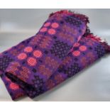 Vintage woollen Welsh tapestry blanket or carthen in black, purple and red colours, traditional