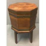 Georgian mahogany octagonal cellarette/wine cooler, the shaped top with ebonised inlay with brass