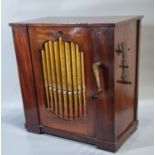 Early 19th century mahogany parlour barrel organ having nine exposed pipes, and apparently