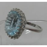 Aquamarine and diamond ring set in 18ct white gold. Aquamarine approx 16 x 14mm surrounded by twenty