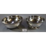 Two Indian silver bowls, both similarly decorated with flowers and foliage to the rims, both