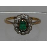 Emerald and diamond oval cluster ring. Ring size R&1/2. Approx weight 3.5 grams. (B.P. 21% + VAT)
