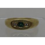 Diamond and green stone ring set in 18ct gold. Ring size R. Approx weight 5.9 grams. (B.P. 21% +