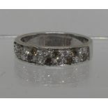 Diamond half eternity style ring of white and champagne coloured diamonds set in 9ct white gold.