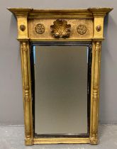 19th century Regency design giltwood pier mirror, having raised shell decoration, moulded roundels