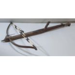 George III English stone crossbow having mahogany stock, steel bow with hinged fork fore sight, and