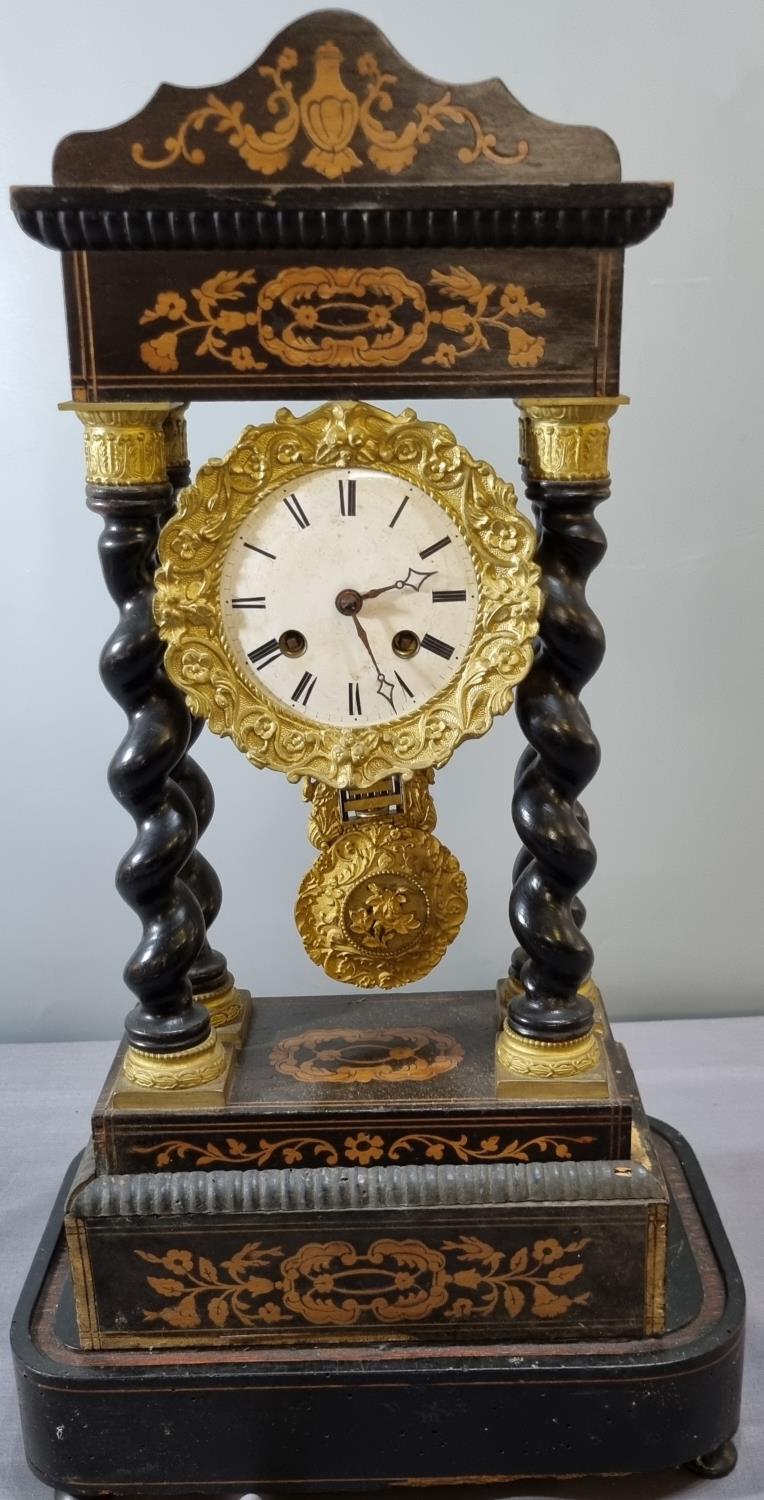 Early 19th century French marquetry inlaid eight day Portico clock with white enamel Roman face