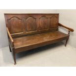 18th century oak settle, of large proportions, the moulded back rail with four fielded panels,