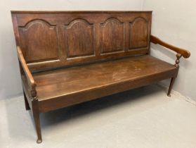 18th century oak settle, of large proportions, the moulded back rail with four fielded panels,
