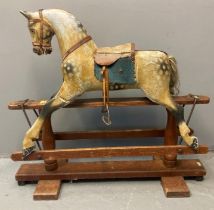 Early 20th century Ayres of London rocking horse, in dapple grey with painted features, glass