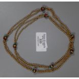 Indian gold necklace decorated with red and green enamel gold beads. Length 31 inches (79cm). Approx