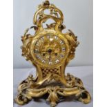 Late 19th century French ormolu rococo style balloon shaped mantle clock, overall decorated with