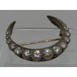 Victorian Diamond crescent brooch set with nineteen old cut diamonds. Diameter 37mm. Approx weight