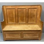 Victorian Welsh pine settle, the high back with three fielded panels, shaped sides with hinged box