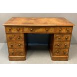 Victorian walnut knee hole desk, the moulded top above a bank of three drawers with turned