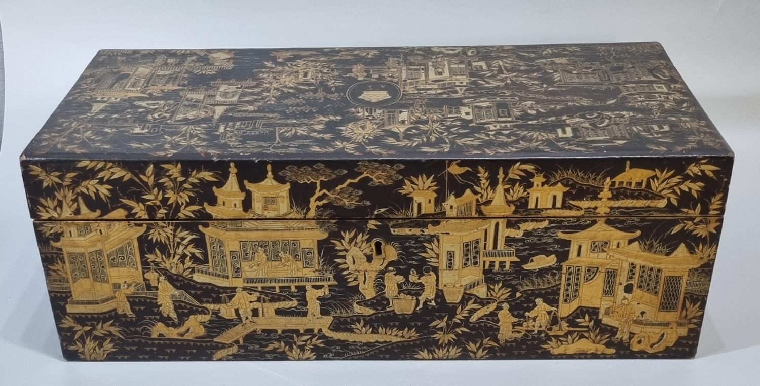 19th century chinoiserie decorated lacquered and gilded writing box, having brass handles, the