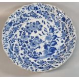 Chinese porcelain underglaze cobalt blue and white dish, with foliate rim depicting flowers and