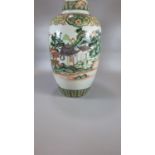 Chinese export porcelain famille Verte ovoid vase and cover painted with figures and a boat in a