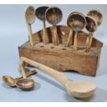 19th century Welsh oak traditional single tier twelve section spoon rack comprising assorted