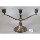 Waikee, Hong Kong, silver three branch candelabra on a circular stepped base. 19.5cm high approx. (