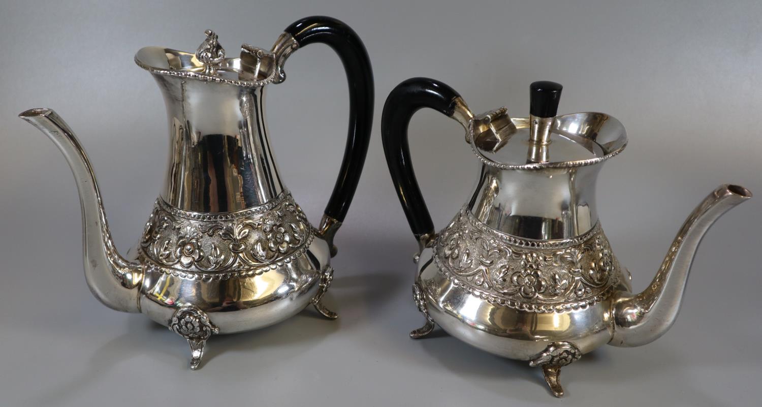 Indian white metal four piece tea service comprising teapot and water jug with ebonised handles, - Image 2 of 3