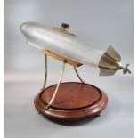 Unusual novelty glass and metal decanter in the form of a stylised Zeppelin airship with miniature