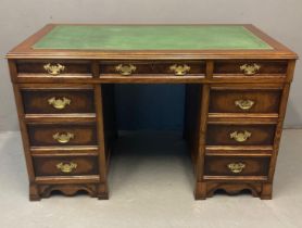 18th century style veneered oak writing desk, the leather and moulded top above a bank of three