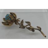 Sunflower brooch delicately modelled as a flower in 18ct gold and set with turquoise stones. In