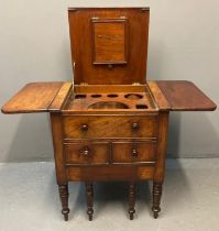 Early 19th century mahogany gentleman's wash stand, the moulded hinged top flanked by two drop