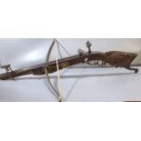 19th century, probably Swiss, target crossbow, having steel bow, heavily carved hardwood full