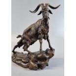 After Pierrre Jules Mene, a patinated bronze model of a mountain goat on a rocky naturalistic