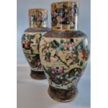 Mirror matched pair of Chinese export stone ware crackle glaze warrior vases, with moulded brown