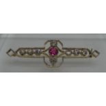 Art Deco Pink corundum and diamond brooch. The central pink stone set with an old cut diamond