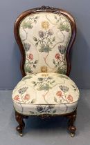 Victorian rosewood high back nursing chair, having stuff over upholstered back and seat with organic
