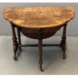 Victorian burr walnut Sutherland table, the shaped and moulded top above ornately carved and