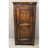 18th century oak cheese/food cupboard, the moulded cornice above a single blind panelled door with