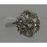 Large diamond cluster ring set in 18ct white gold. The brilliant cut diamonds an estimated total