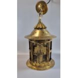 Arts and Crafts design brass hall lantern, the fluted gallery above circular brass and glass panels,