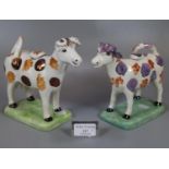 Two similar 19th century style splash lustre cow creamers, one dated to the underside 1986, 65/100