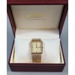 Rotary 9ct gold gentleman's bracelet dress wristwatch with square dial. 40g approx. In original box.
