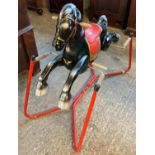 Mobo type child's metal rocking horse on tubular sprung stand. (B.P. 21% + VAT)