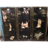 Three Chinese style lacquered and gilded panels with relief figural decoration. 78x32cm approx. (