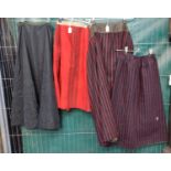 Four antique (probably late 19th Century) skirts to include: three traditional Welsh costume woollen