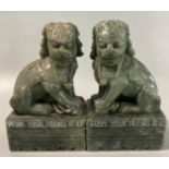 Pair of carved Chinese probably soap stone green Temple Lions on integral stands with etched