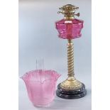 Early 20th century double oil burner lamp having clear and frosted etched cranberry glass foliate